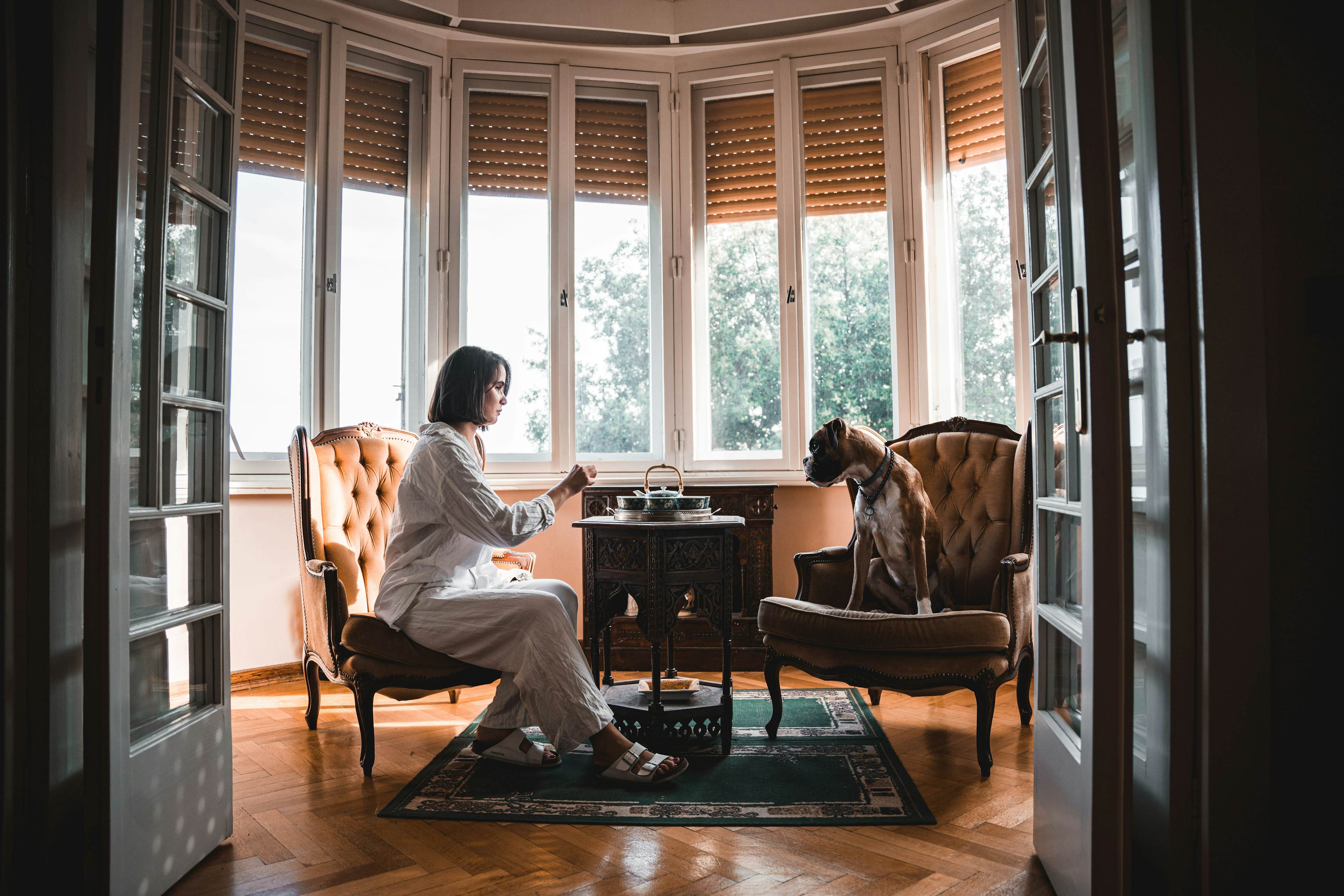 Woman pet sitter being happy with her dog.